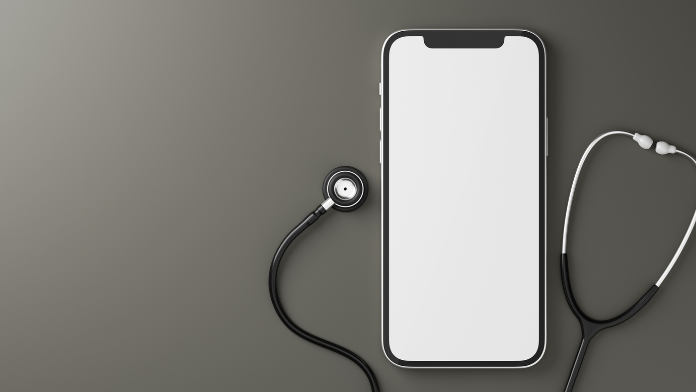 Smartphone blank screen mockup and stethoscope on grey bg